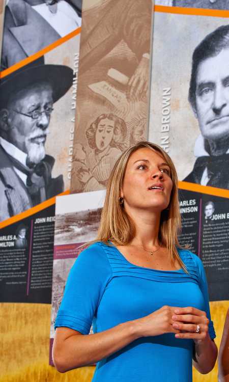 Two women learning more about the Freedom's Frontier Heritage Area at the Watkins Museum in Lawrence.