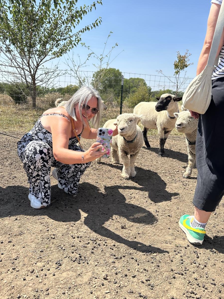 Woman takes selfie with goat